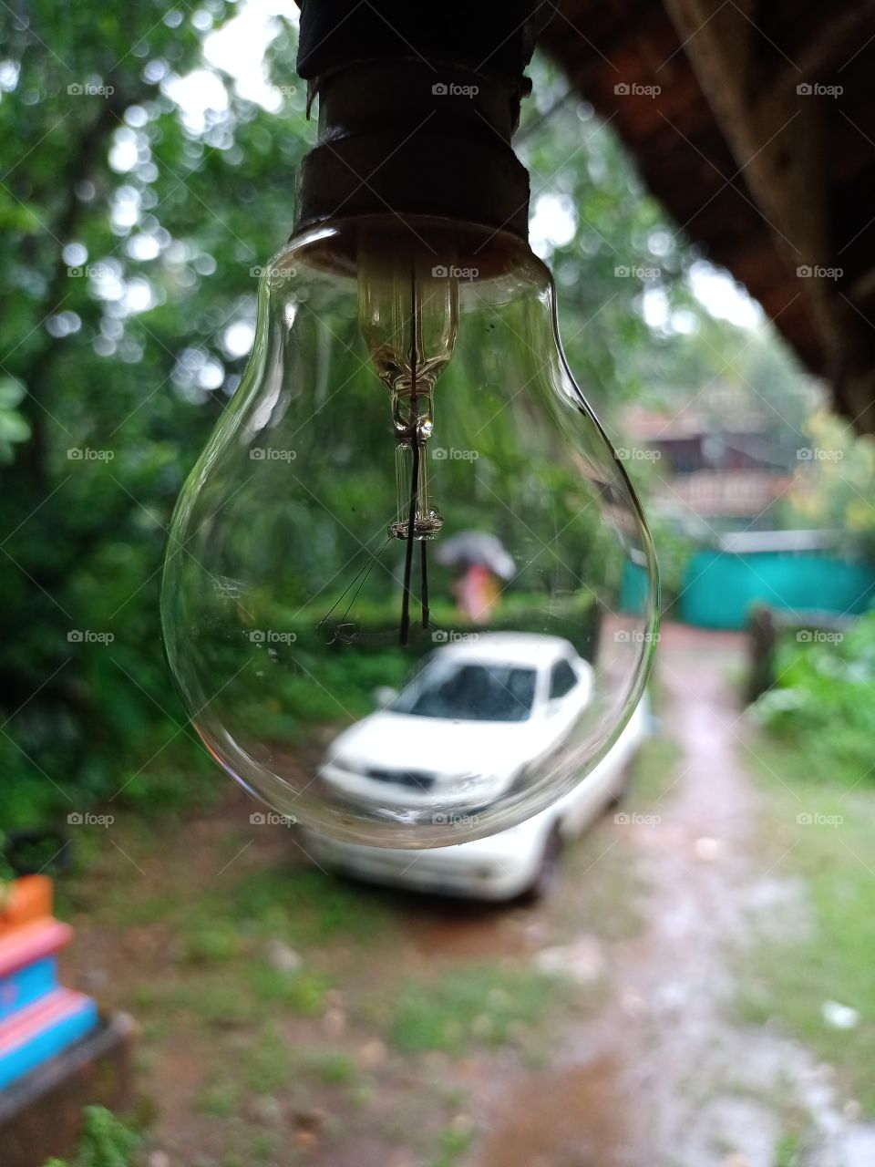 the electric bulb is out of  house beautiful view of nature rainy season hanging bulb rain drops
