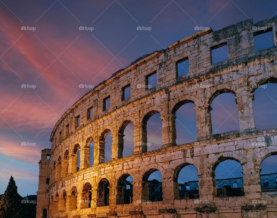 Beautiful ancient monument during sunset, Roman amphitheatre in Pula, Croatia