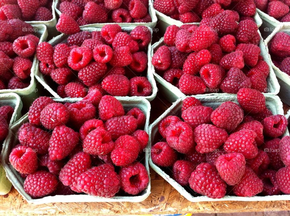 Boxes with fresh raspberries.