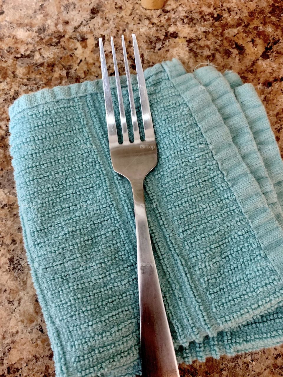 Fork on blue napkin