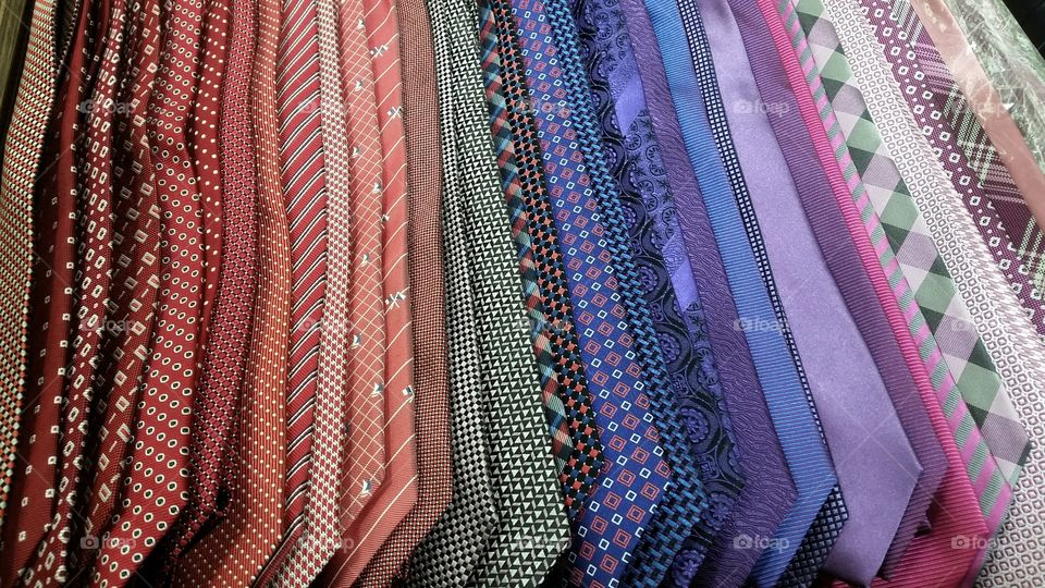 Your choice or mine?. eye-catching selection of neckties, various hues and patterns.
