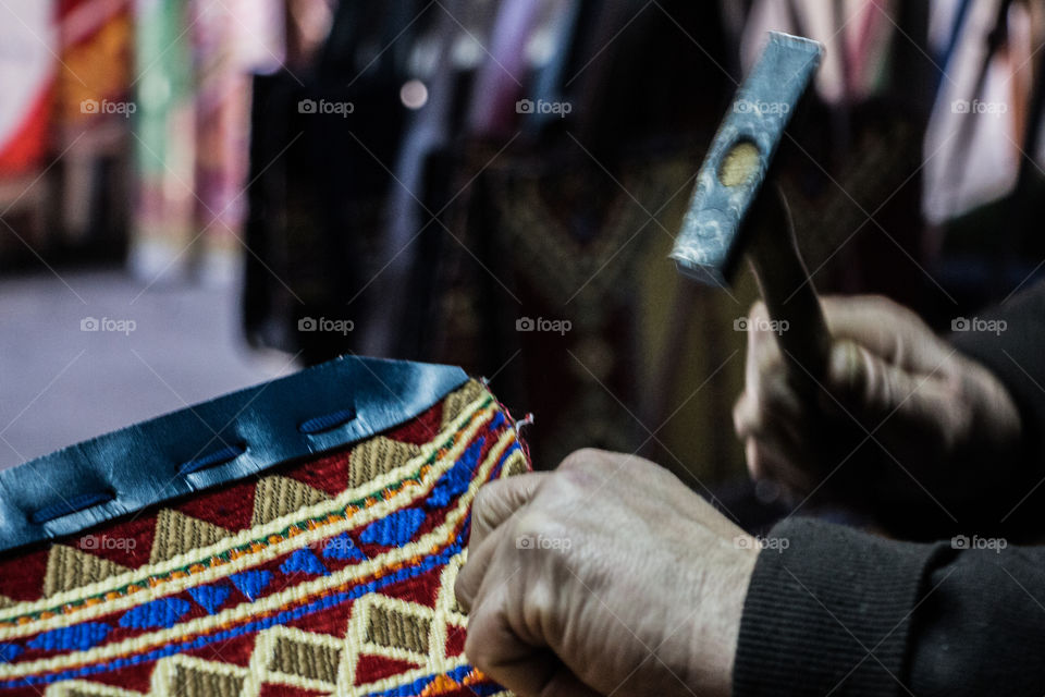 This man is creating handmade purses with very good leather and amazing colors. I am posting the stages of cutting and finishing those purses using different tools.