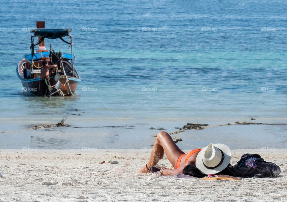 Relax with sunbath on beautiful beach