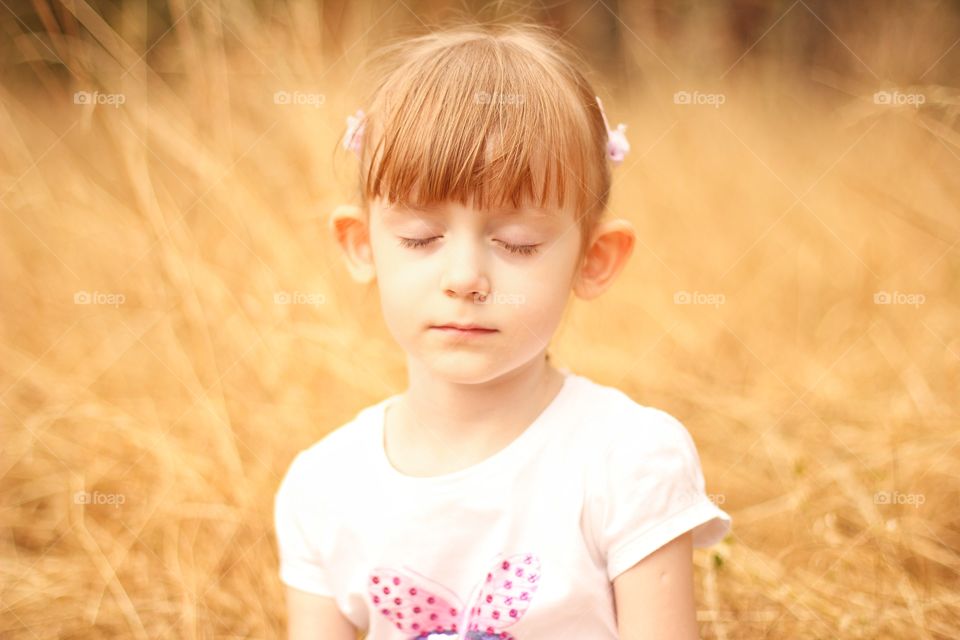 Little girl basking in the sun