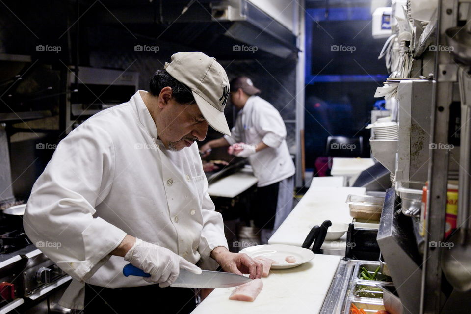 Chef knife. Chef cutting with a knife