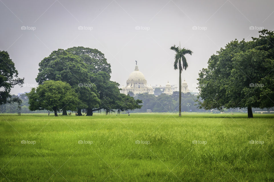 Beautiful image of Victoria Memorial snap from distance, from Moidan, Kolkata , Calcutta, West Bengal, India. A Historical Monument, large marble building dedicated to memory of Queen Victoria.