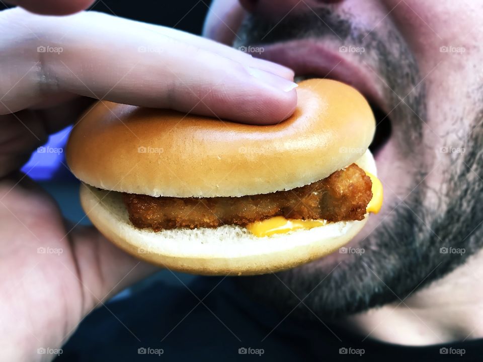 Eating a favorite cheeseburger 