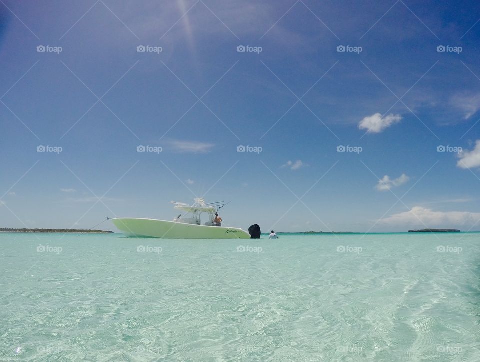 Yellowfin boat in clear waters of Exumas, Bahamas 