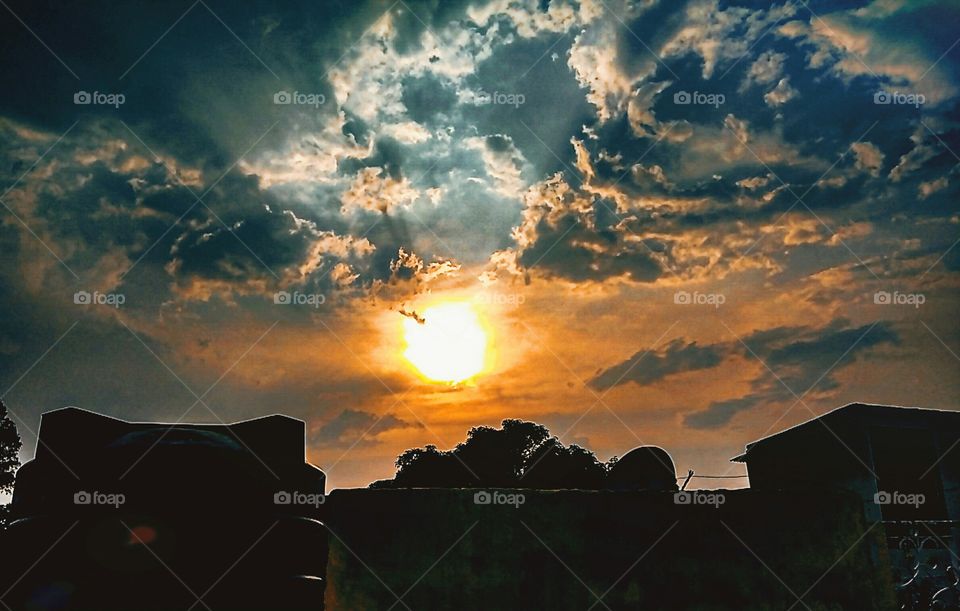 sunset under the dark clouds looks very beautiful negative space picture