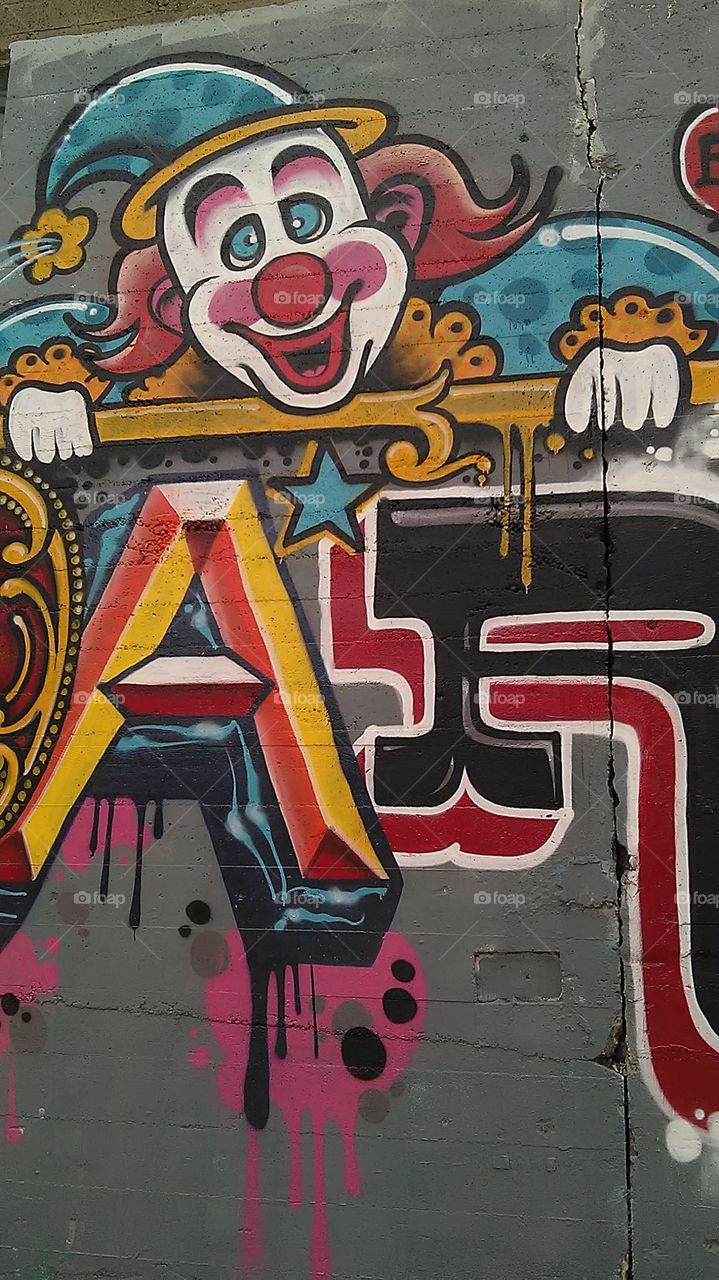 Back alley clown. Driving through the alley