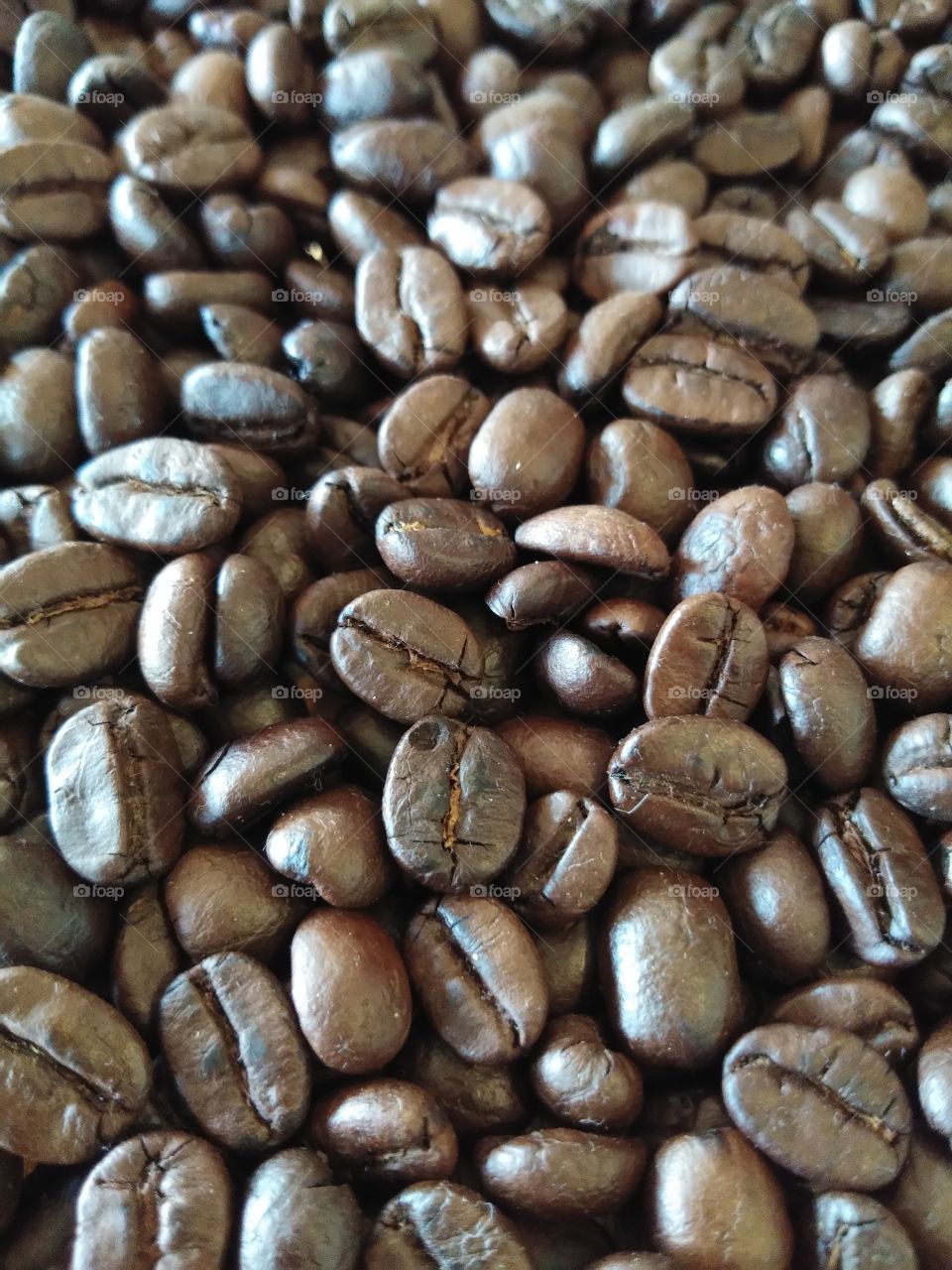 Close up of roasted coffee beans for background.