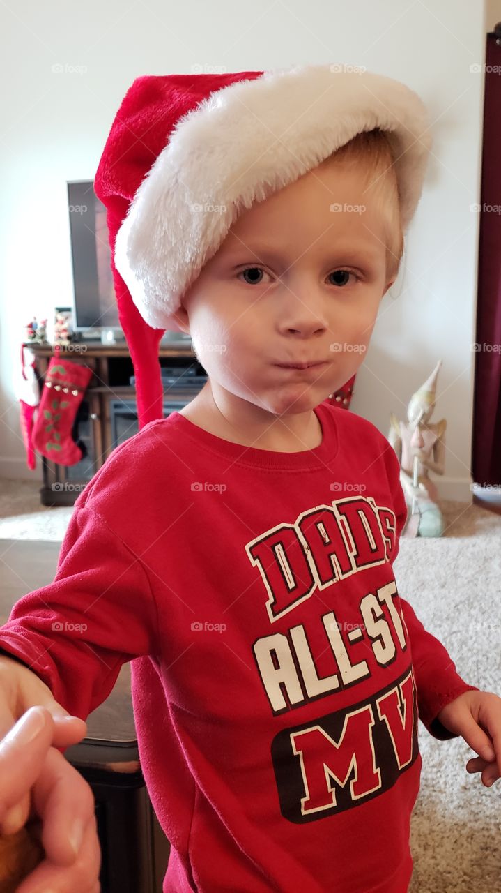 boy wearing Santa's hat