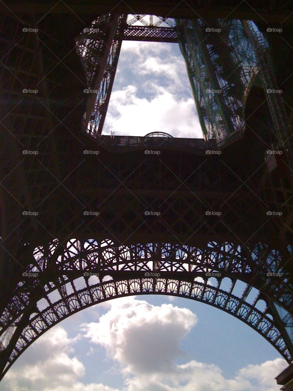 Under the Eiffel Tower. Arches of the Eiffel viewed from below