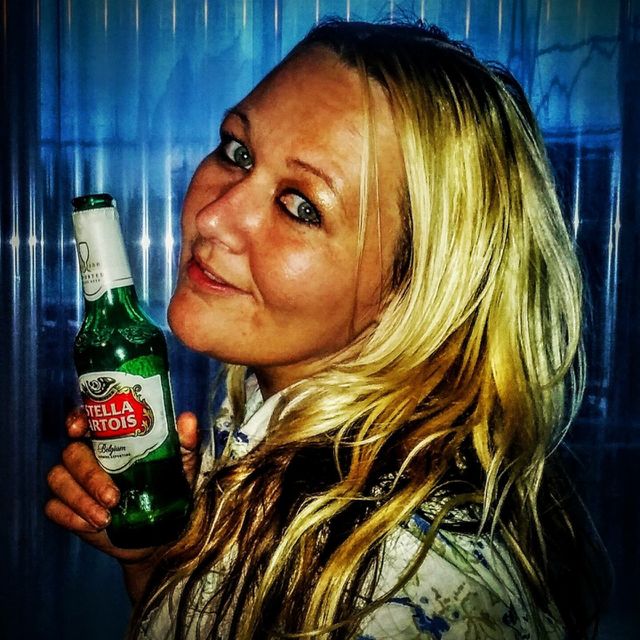 My sister sipping on a beer.