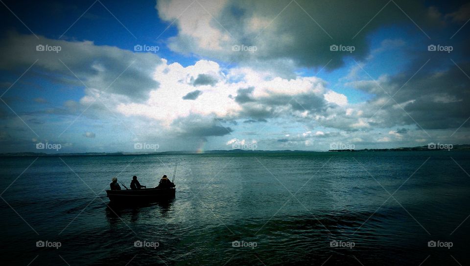 fishermen and the rainbow. after work i was going to the beach to observe the local fishermen