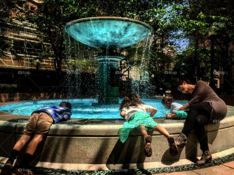 Cousins at at water fountain in Arlington, Virginia 