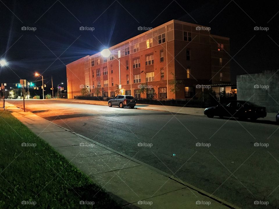 Brick building on a dark desolate deserted street at night