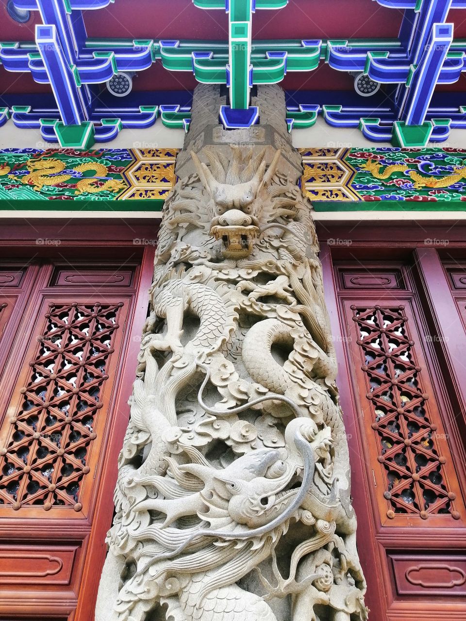 One of the support pillars of a Chinese monastery depicting the strength and fierceness of the mythical dragon.