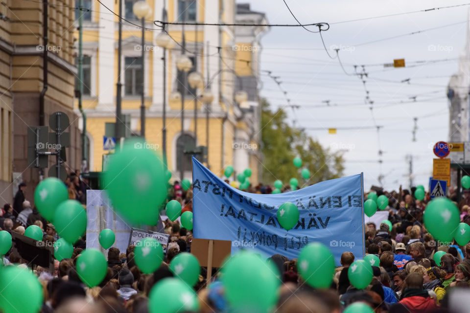 Helsinki, Finland – September 24, 2016: Unidentified protesters march in a demonstration against racism and right wing extremist violence on Aleksanterinkatu in the center of Helsinki, Finland on 24 September 2016.
