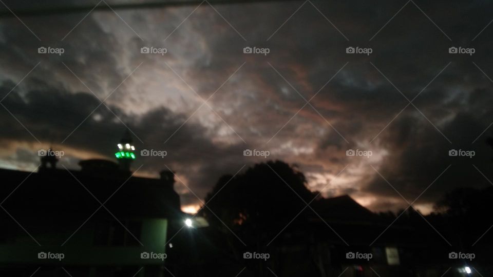 Evening with the light of mosque tower.