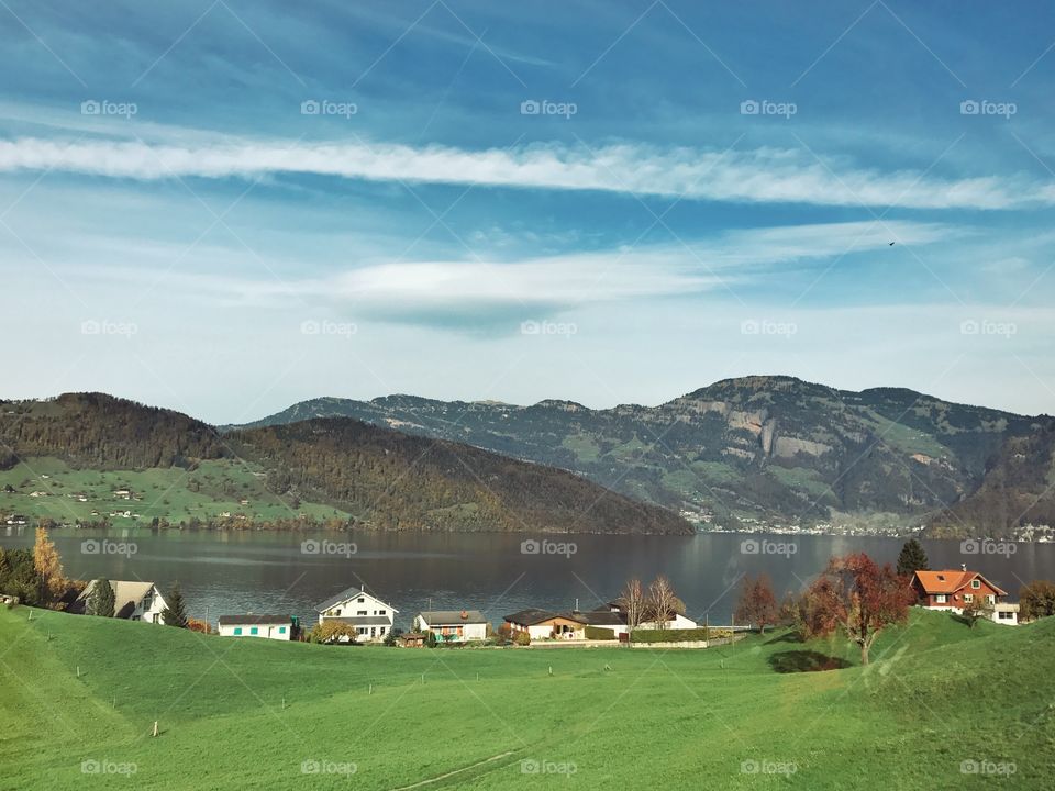 Green field, lake and mountain in Switzerland 