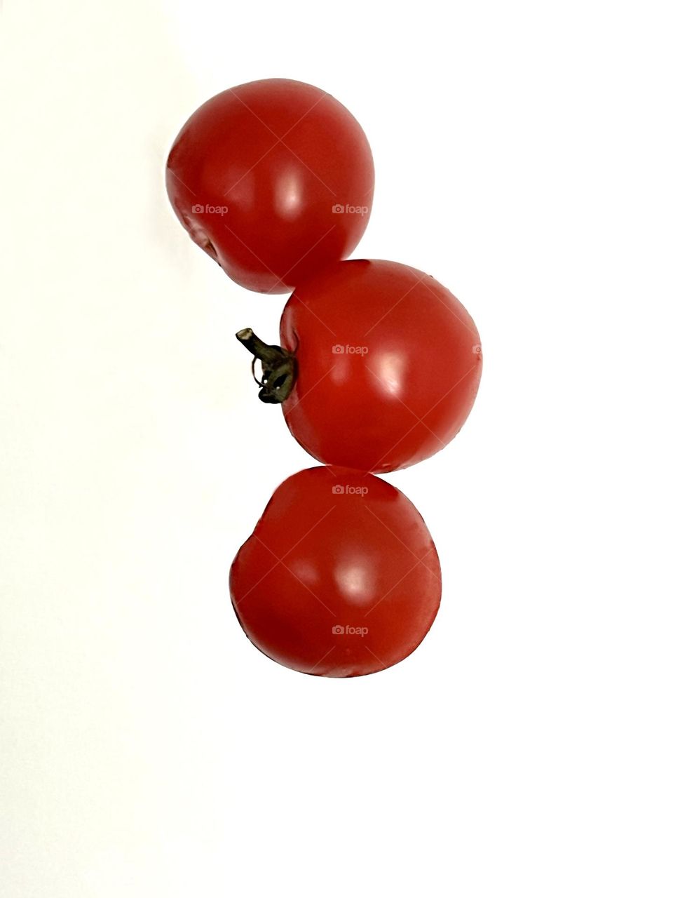 Cherry tomatoes shot on white background
