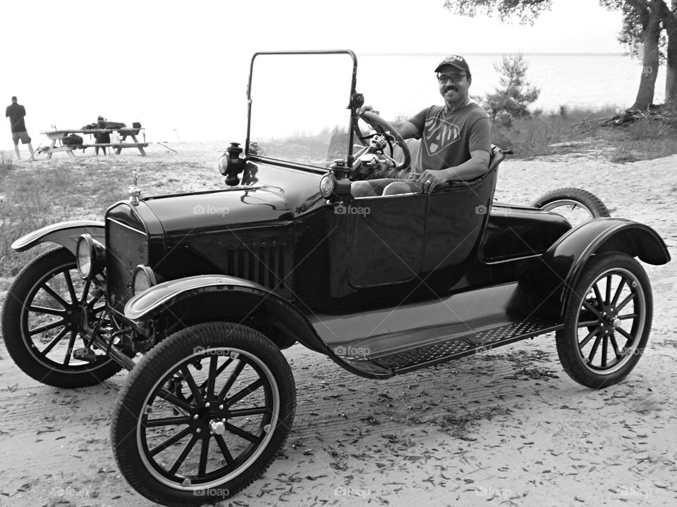 Vintage Vibes: Sitting in a Vintage 1927 Ford “Tin Lizzie”. It was the first mass-produced automobile, making it affordable for the average person.