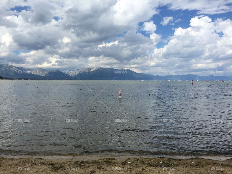 Sea against cloudy sky