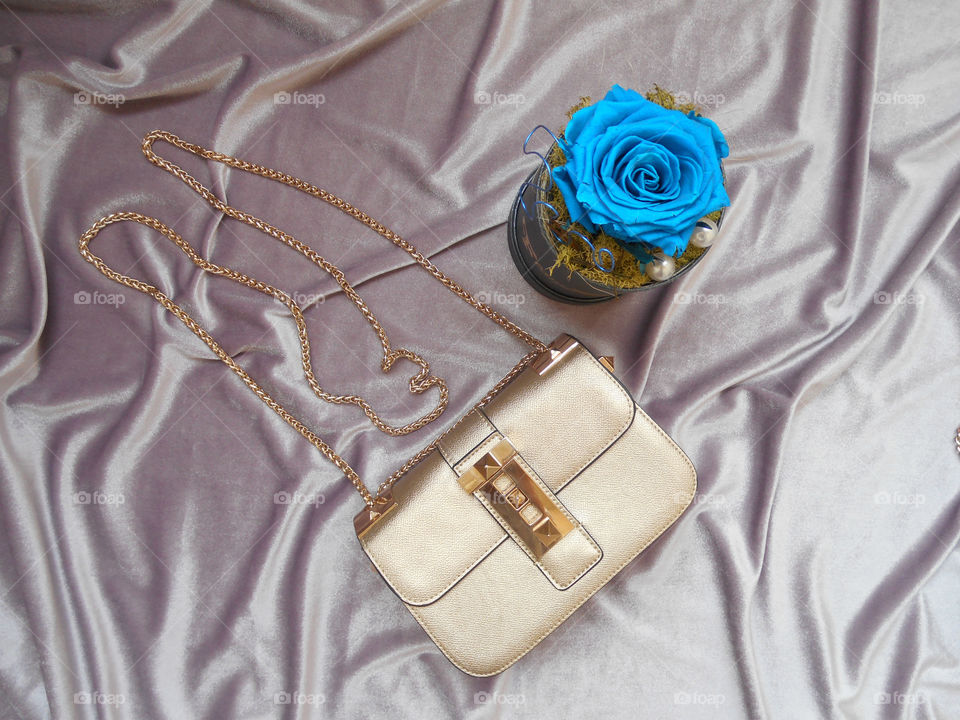 Blue rose and hand bag