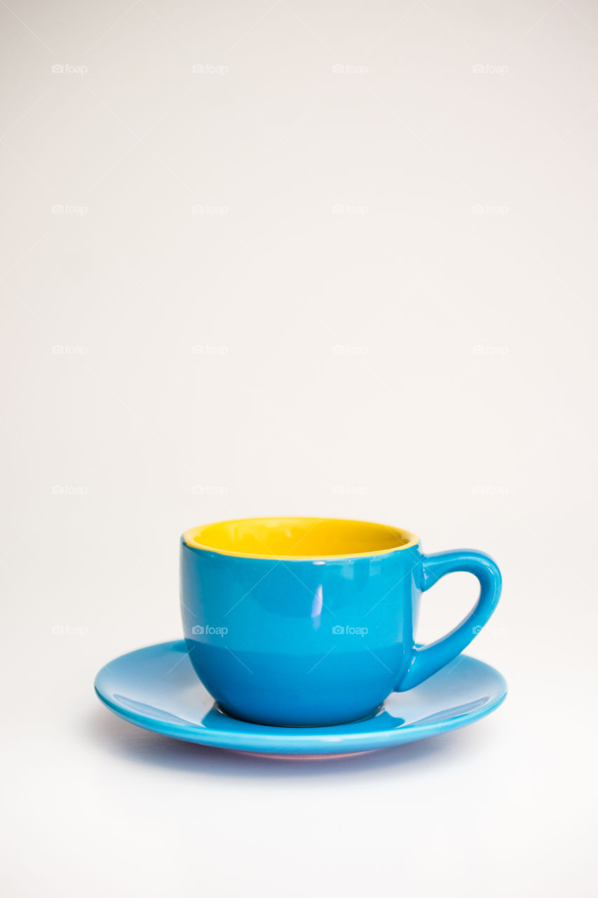 Blue cup on white background