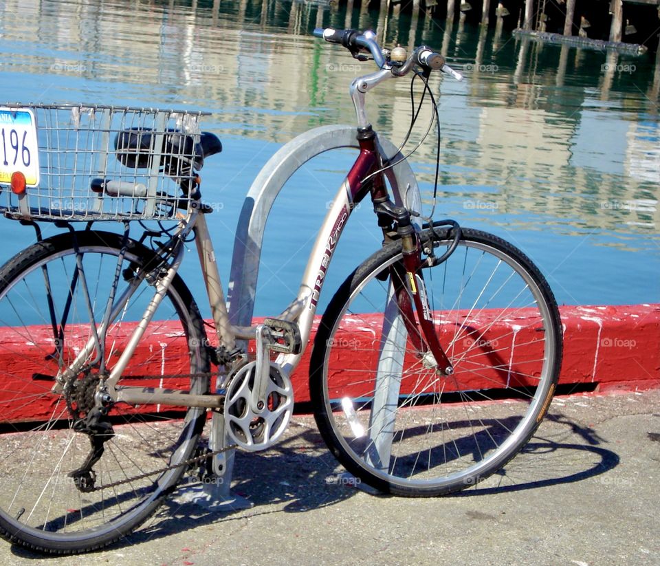 Bicycle parked by water