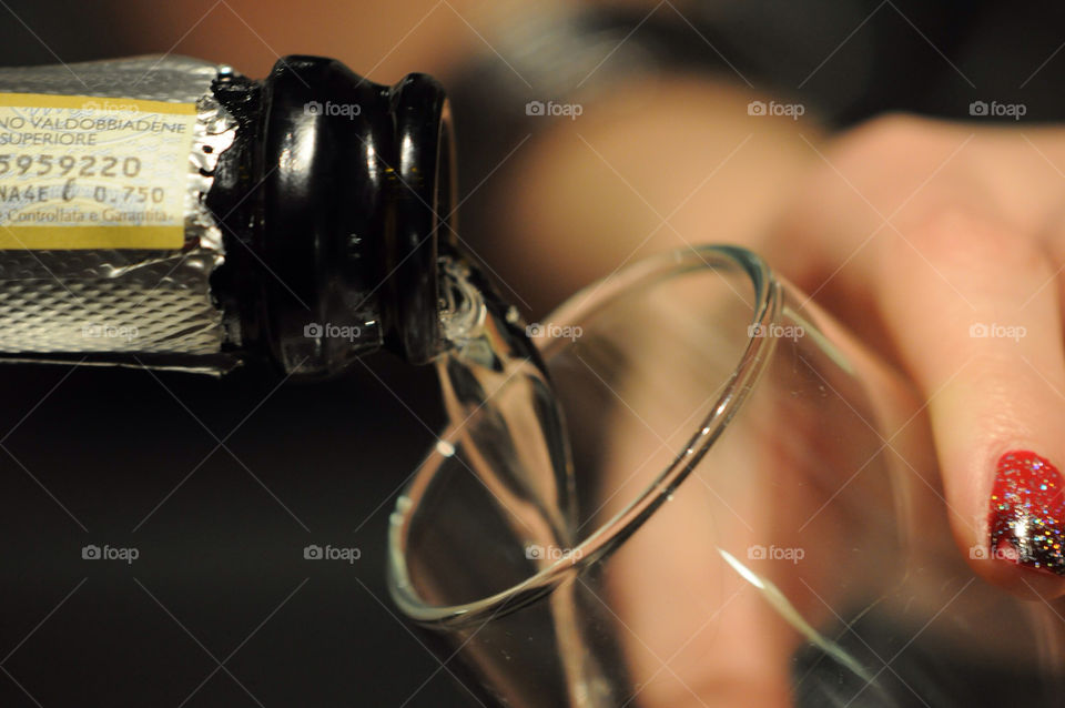 Pouring a glass of prosecco