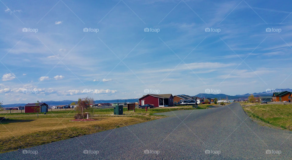 Straight road leading toward village