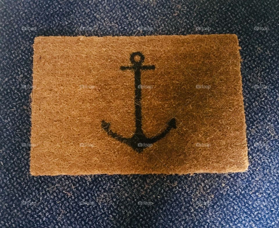 Door mat with anchor symbol