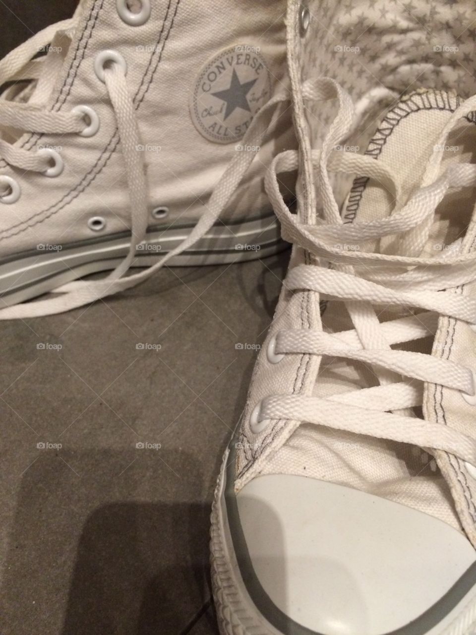 Pair of shoes on the floor. Pair of converse 