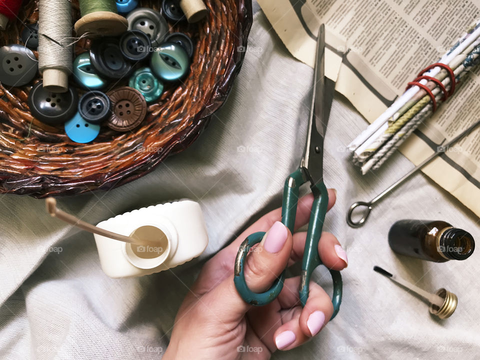 Flat lay rustic items for paper basket weaving from old newspapers 