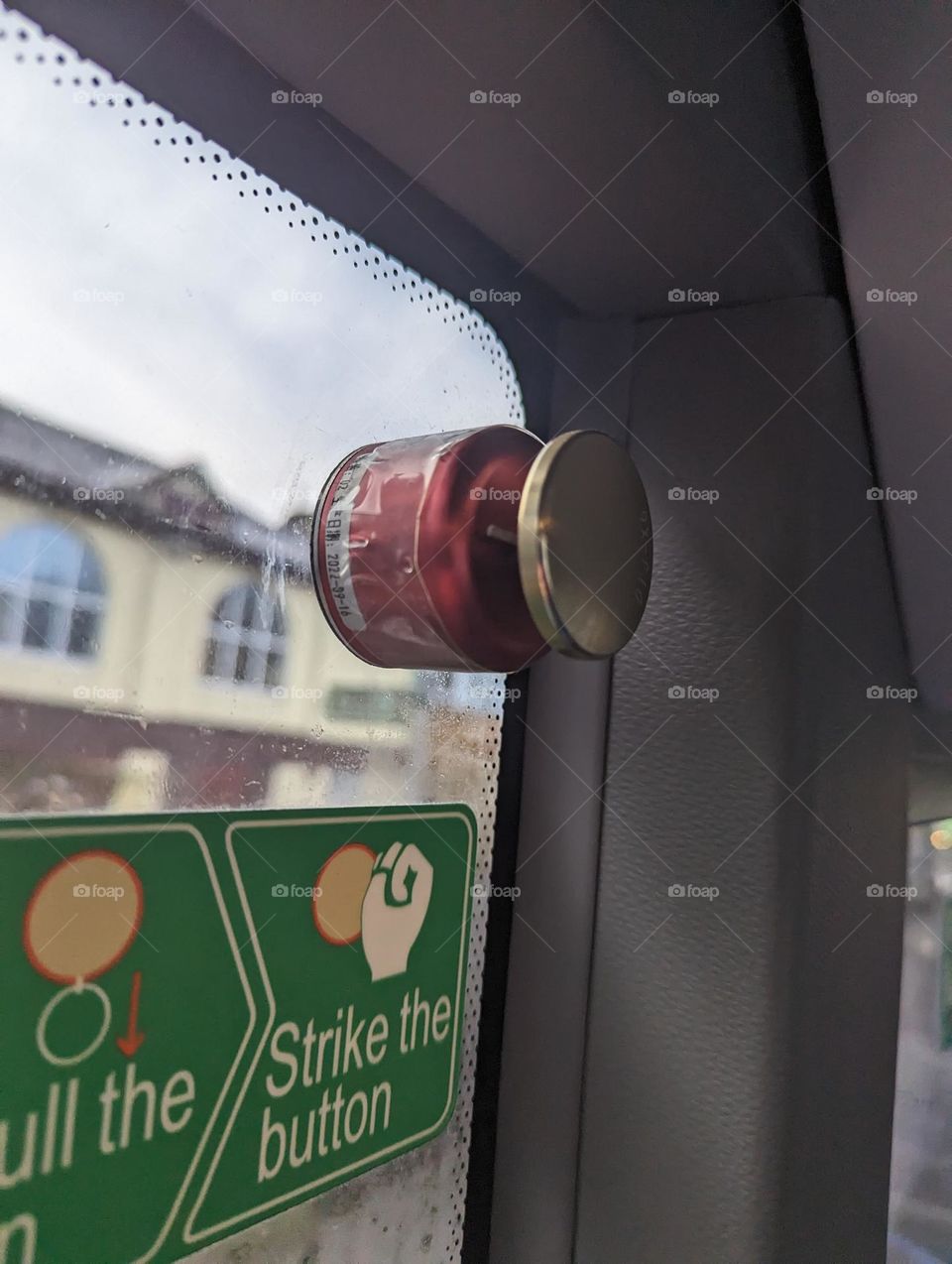 Emergency break glass button on bus