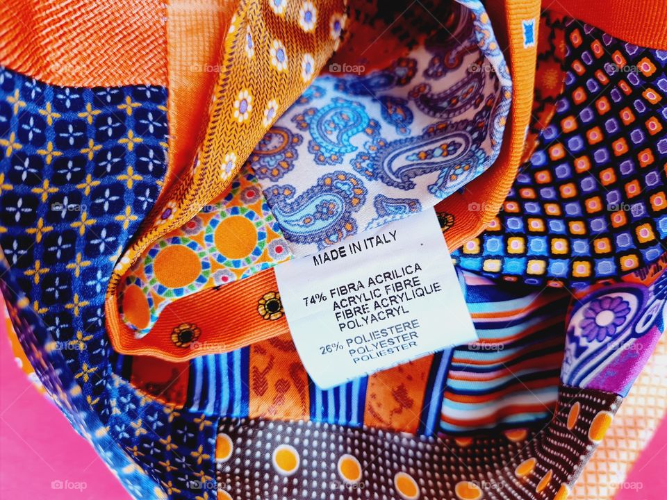 written made in italy on multicolor silk foulard