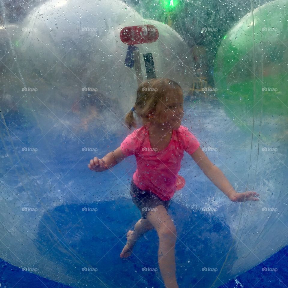 Girl inside an inflatable ball