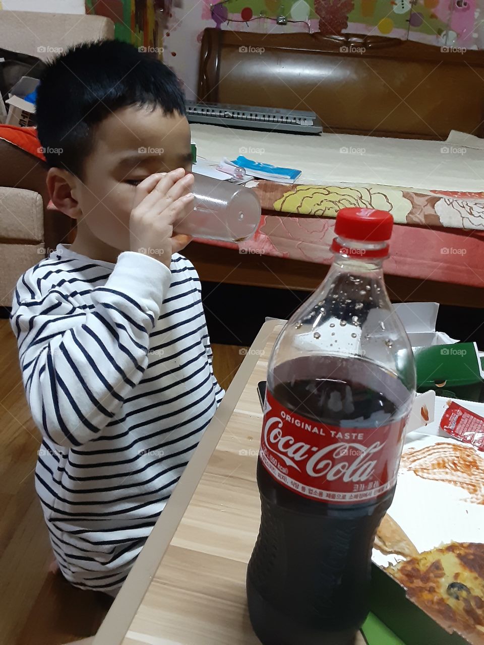 drinking his favorate coca cola