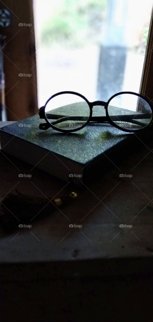 Book and Eyeglasses