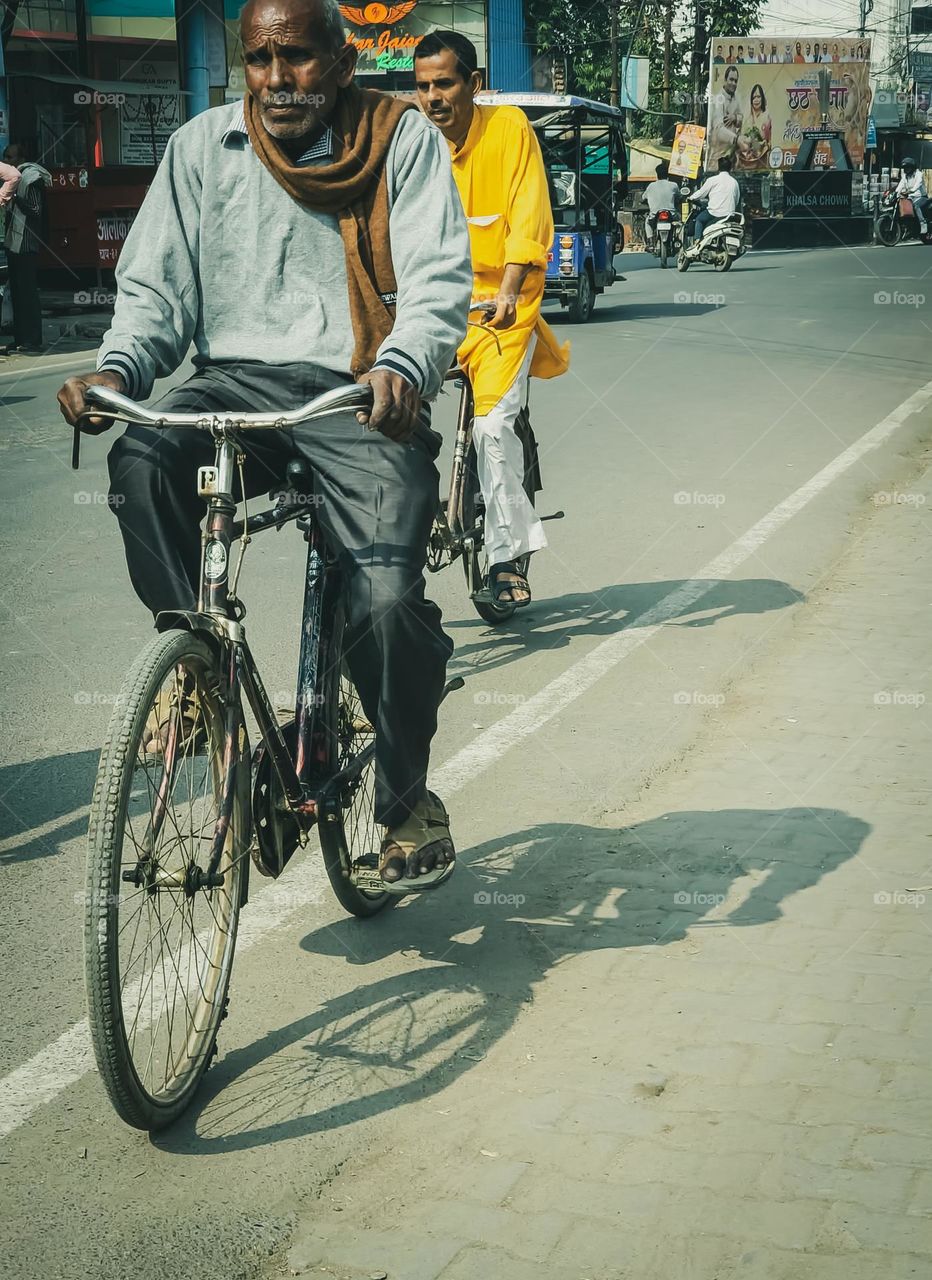 Indian people travelling on bicycle