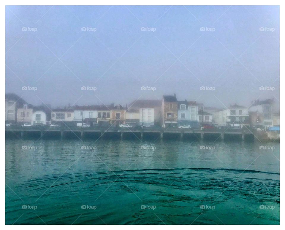 view of the city Le Sable d’Olonne in a foggy morning