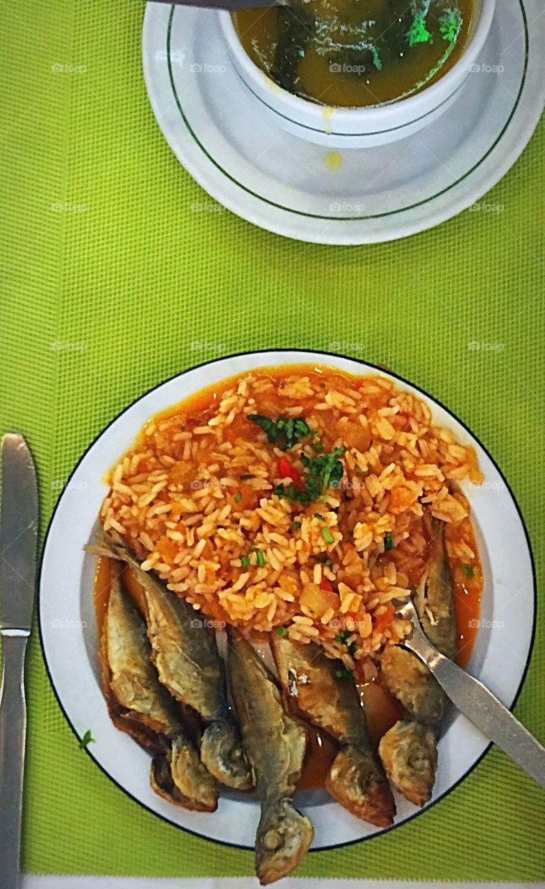 Traditional portages fish sardines with rice and  soup for lunch 