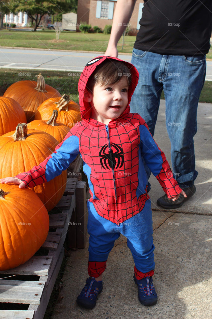 Picking out his first pumpkin 