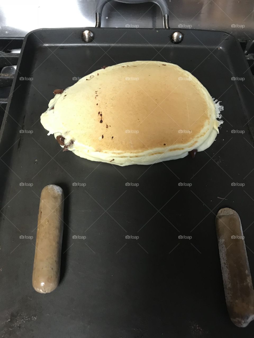 Pancake and sausage on the grill 