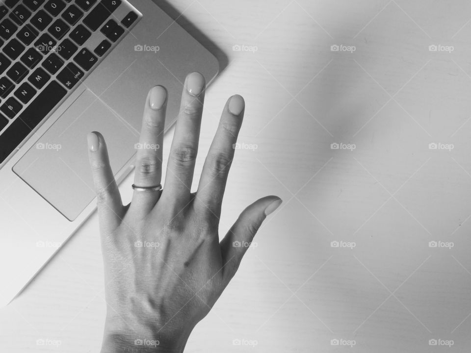 Hand and MacBook 