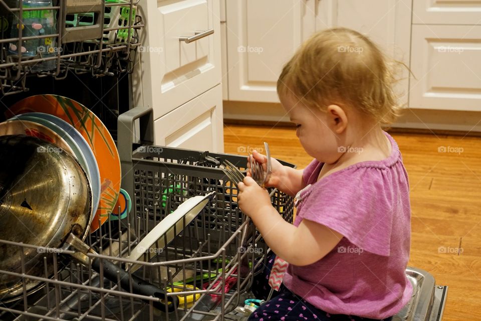 Little Girl Helping With Household Chores