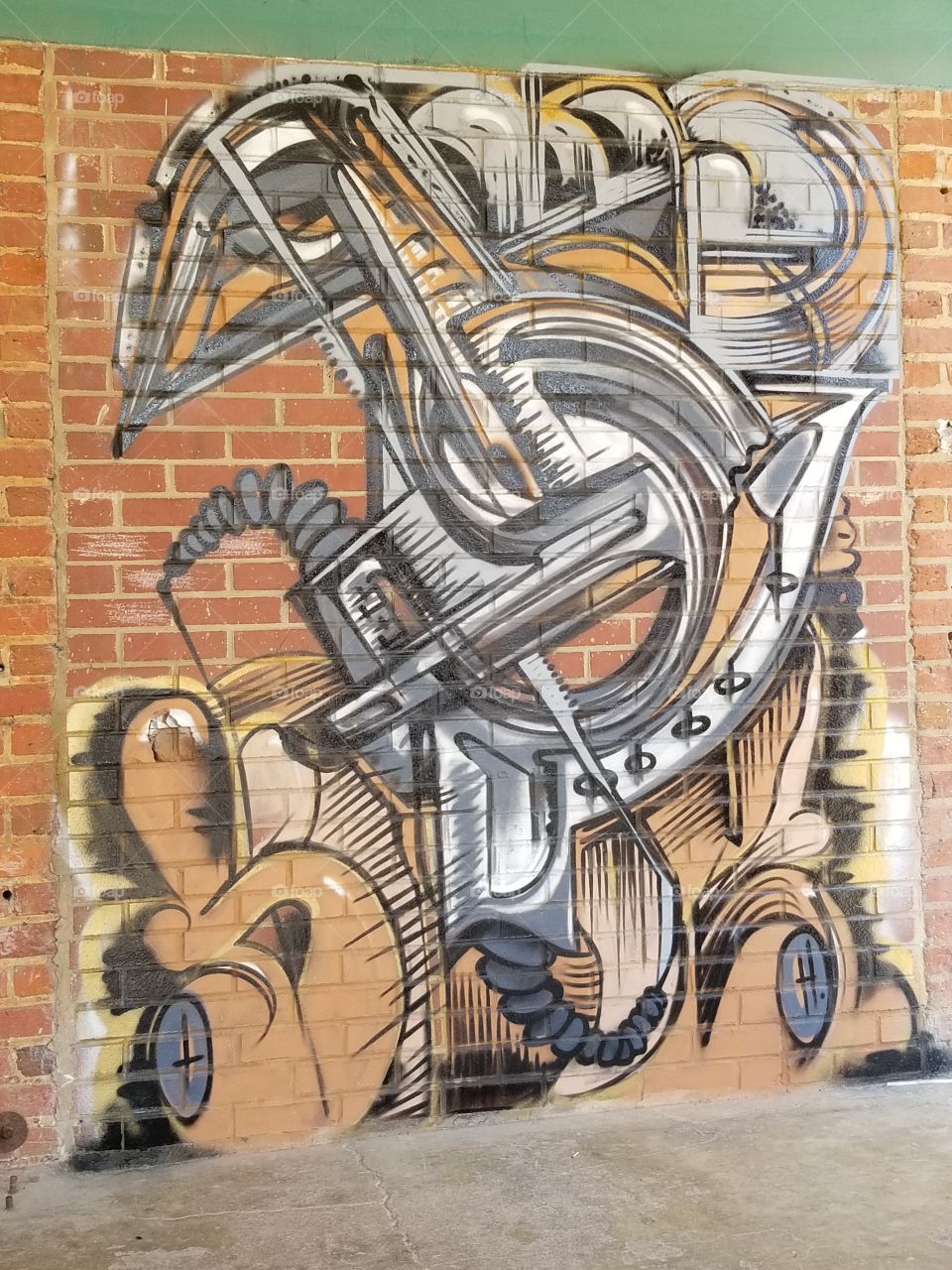 Graffiti abstract artworks downtown brick wall.