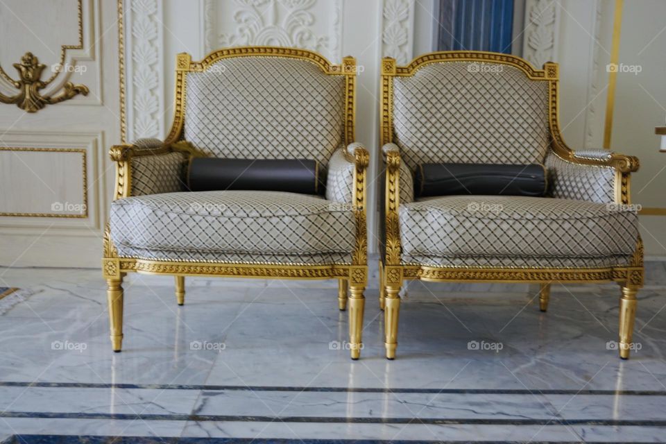 Luxury Symmetry picture of golden chairs 